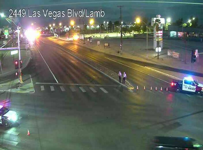 Police block the intersection of North Las Vegas and North Lamb boulevards after a crash Friday ...