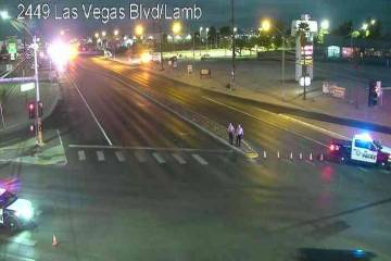 Police block the intersection of North Las Vegas and North Lamb boulevards after a crash Friday ...