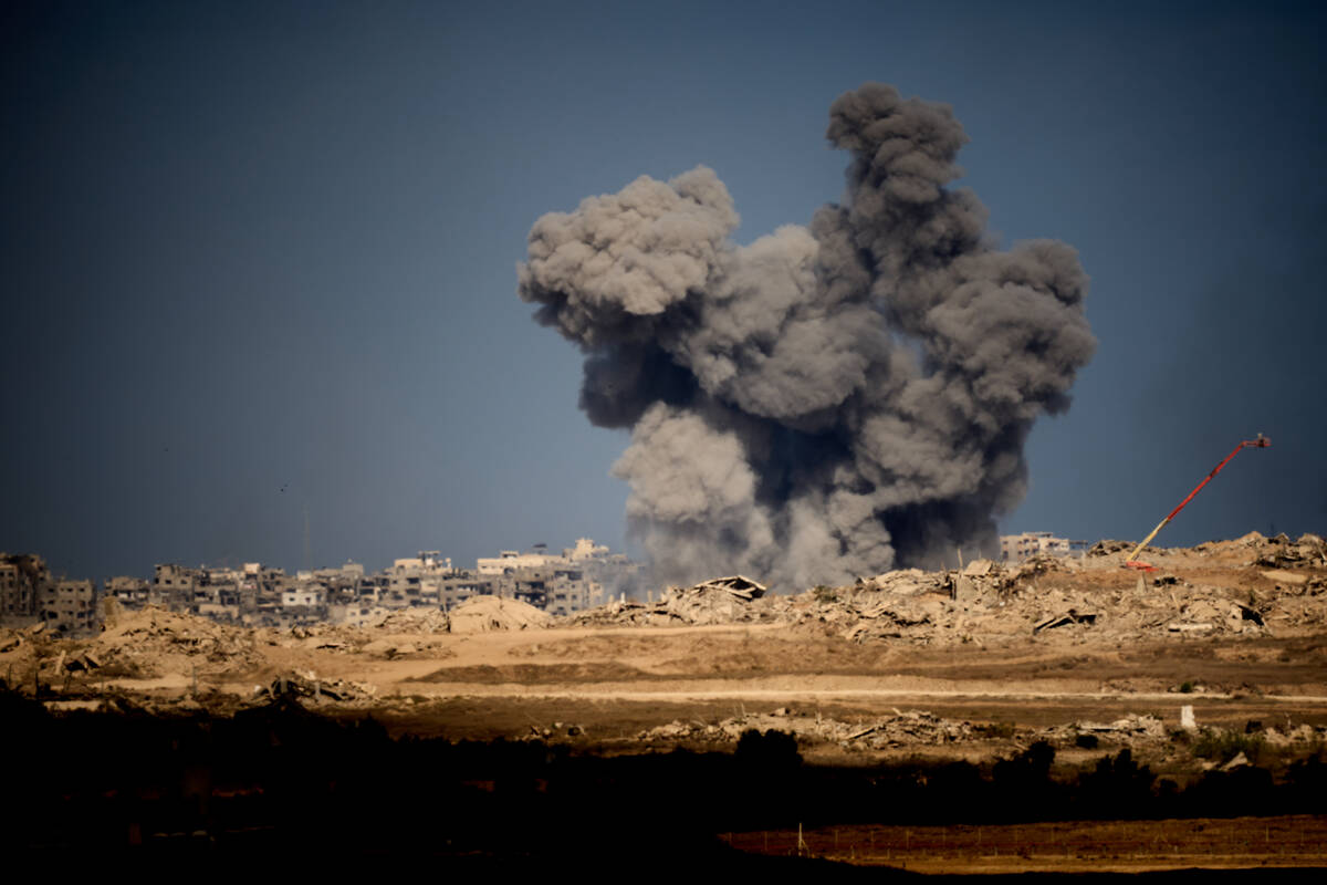 Smoke rises to the sky following an Israeli military strike in the Gaza Strip, as seen from sou ...