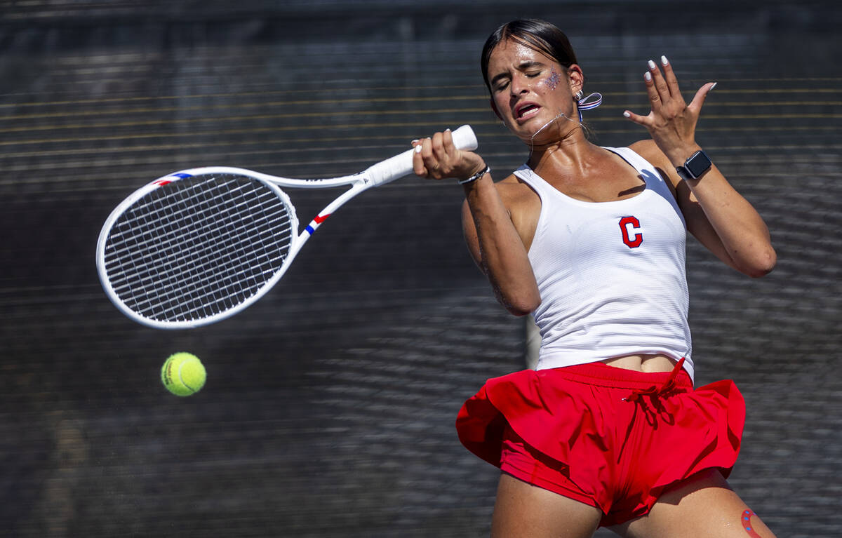 Coronado's Erika Gallegos returns a ball to a Palo Verde player in their singles match dur ...