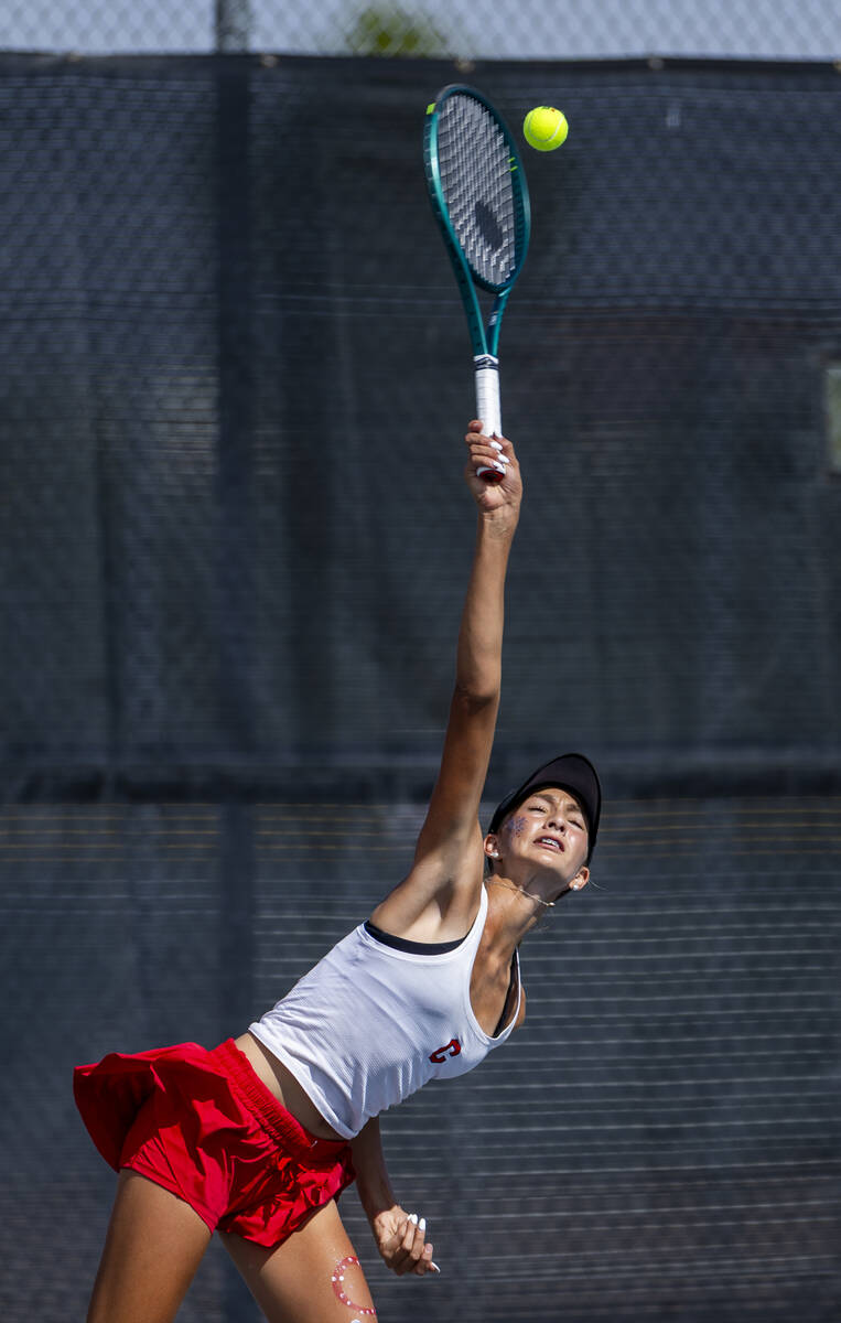 Coronado's Kamilah Saine serves the ball to a Palo Verde player in their singles match dur ...