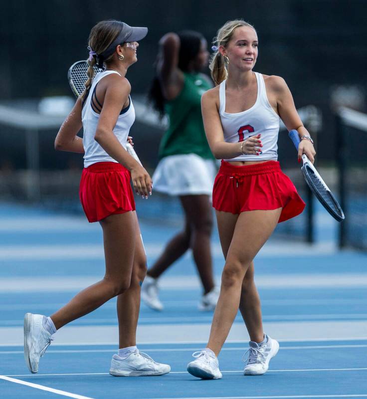 Coronado's Isabella Gallegos and Gigi Smart come together to chat in their doubles match a ...