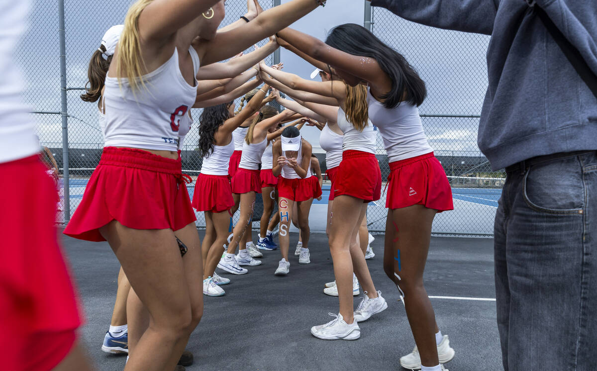 Coronado players celebrate a double's team coming off the court against Palo Verde winning ...
