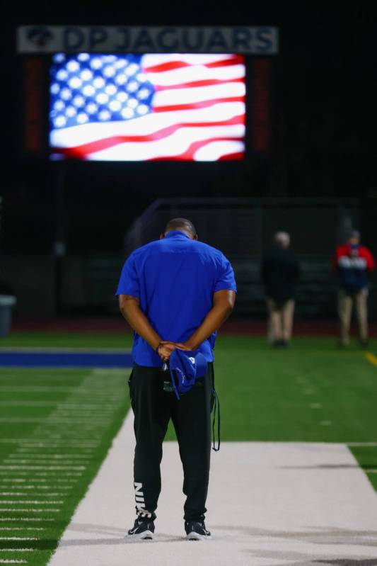 The national anthem plays before a football game between Desert Pines and Las Vegas High School ...