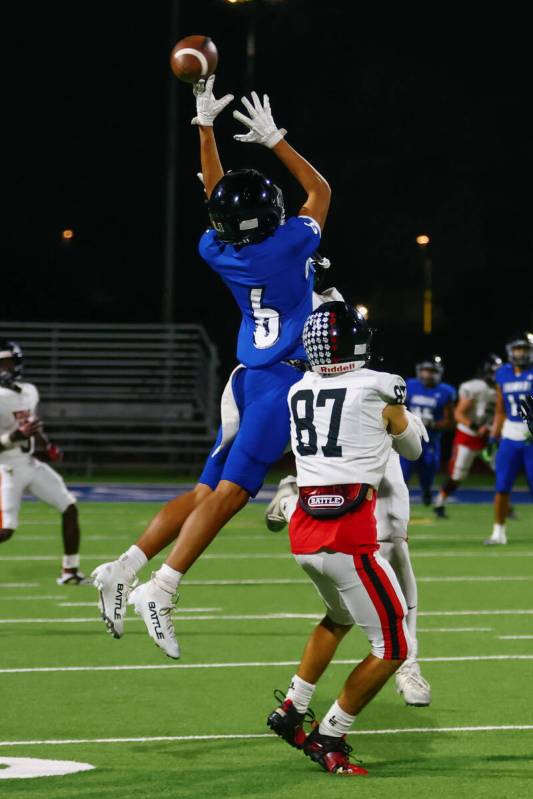 Desert Pines cornerback Jaisun Gill (6) breaks up a pass intended for Las Vegas wide receiver R ...