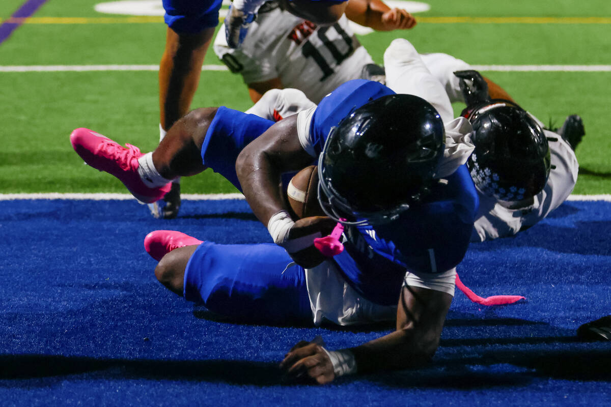 Desert Pines’ Michael Taylor (1) makes a touchdown during a football game on Friday, Oct ...