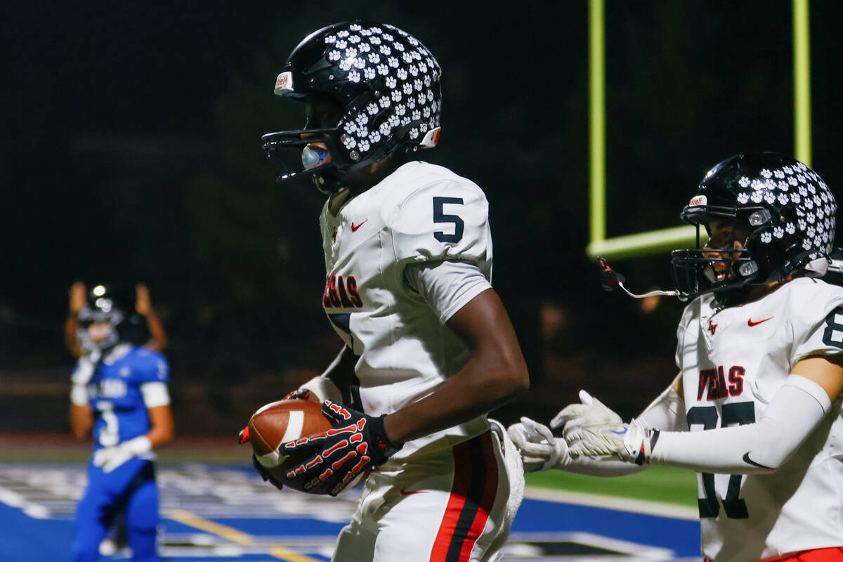 Las Vegas’ Dasean Deayon (5) celebrates running in a touchdown during a football game on ...