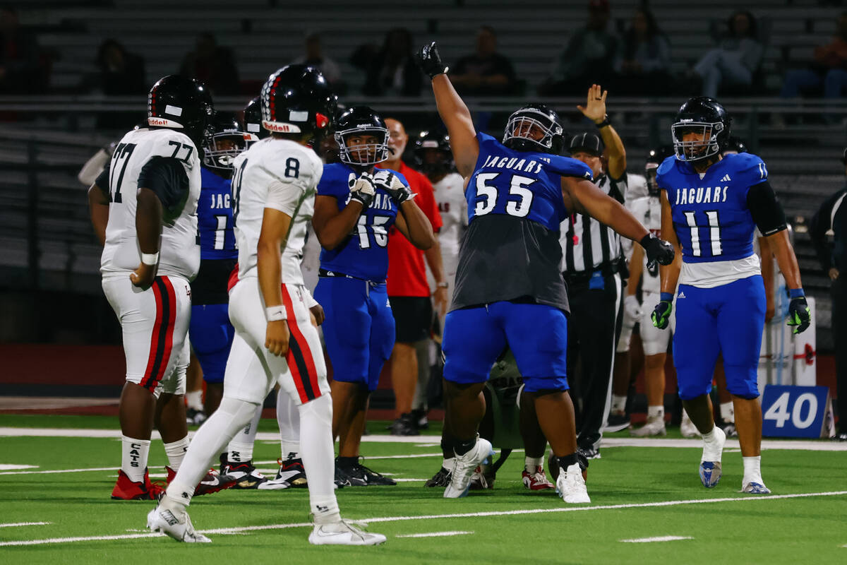 Desert Pines defensive tackle Rayshawn Brown (55) celebrates a successful tackle during a footb ...