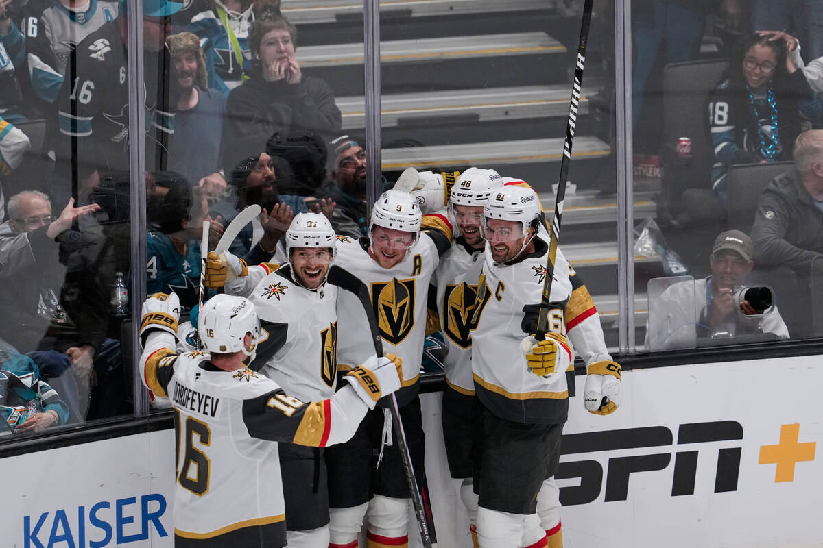 Vegas Golden Knights center Jack Eichel (9) celebrates with teammates after scoring a goal duri ...