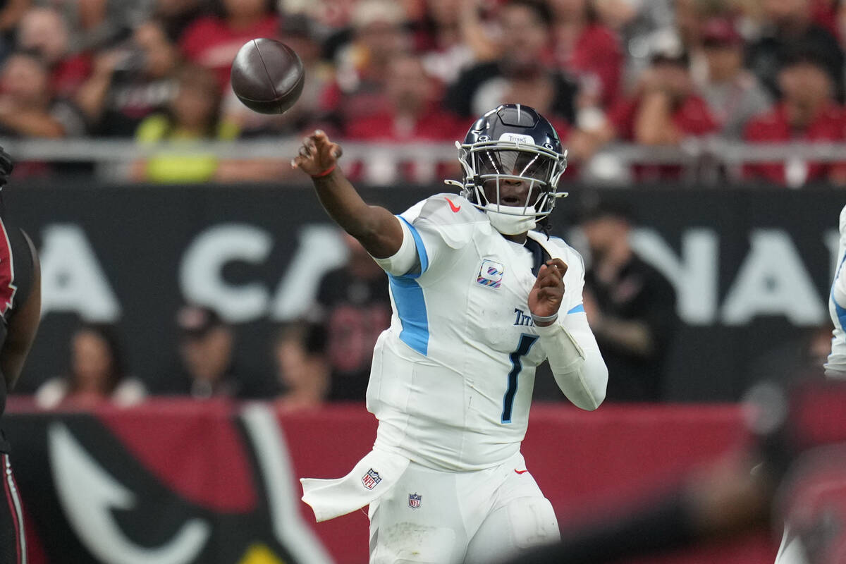 Tennessee Titans quarterback Cam Ward (1) throws the ball against the Arizona Cardinals during ...