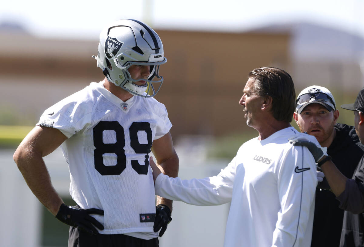 Raiders tight end Brock Bowers (89) listens quarterbacks coach Greg Olson to during practice at ...