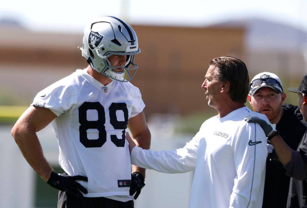 Raiders tight end Brock Bowers (89) listens quarterbacks coach Greg Olson to during practice at ...