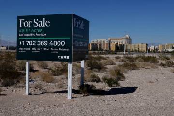 A for sale sign by brokerage CBRE Group is posted on a vacant land on the northwest corner of L ...