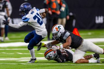 Canyon Springs running back Bakari Wilson (21) breaks free against Mojave during the second hal ...