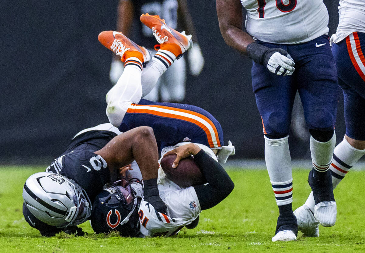 Raiders defensive end Tyree Wilson (9) sacks Chicago Bears quarterback Caleb Williams (18) duri ...
