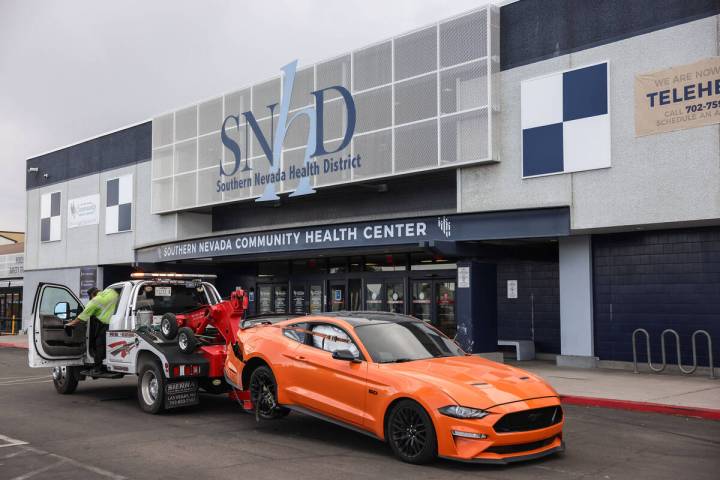 A vehicle is prepped to be towed after striking the Southern Nevada Health District’s main pu ...