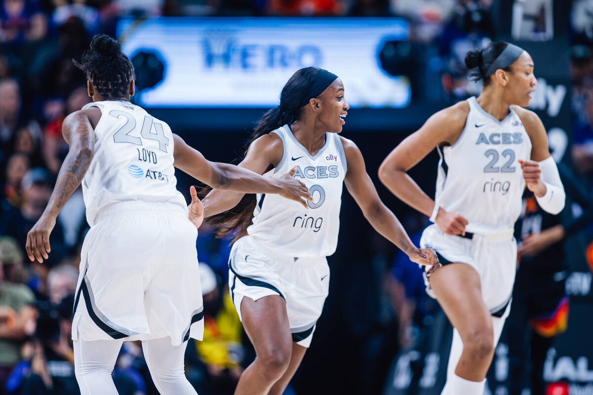 Aces guard Jewell Loyd (24) high-fives Aces guard Jackie Young (0) during game four of a WNBA f ...