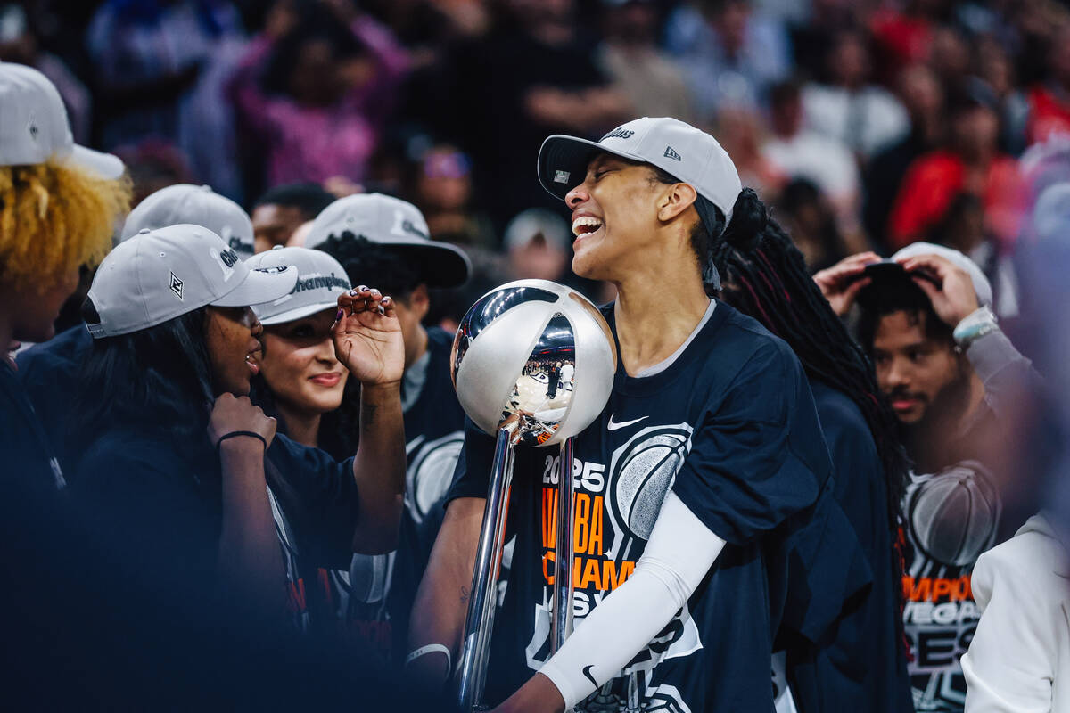 Aces center A'ja Wilson (22) celebrates winning the WNBA championship during game four of ...
