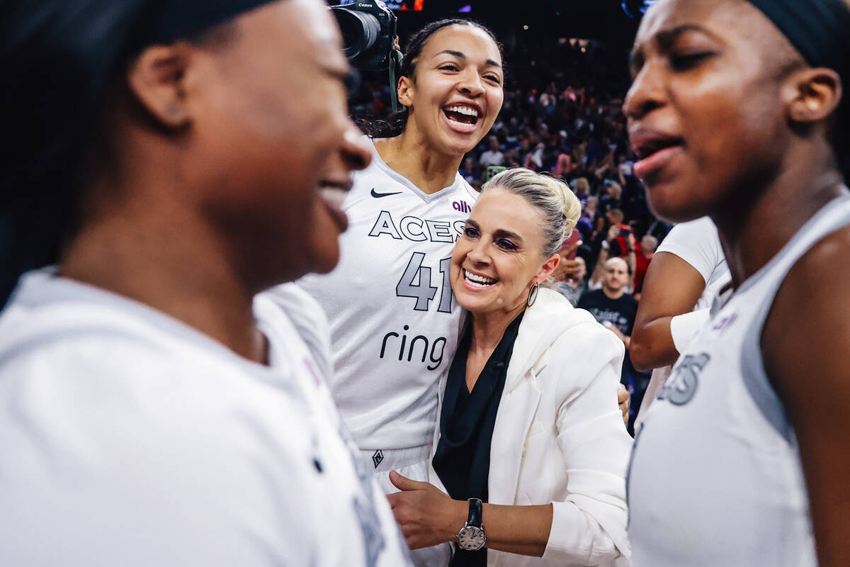 Aces center Kiah Stokes (41) celebrates winning the WNBA Championship with head coach Becky Ham ...