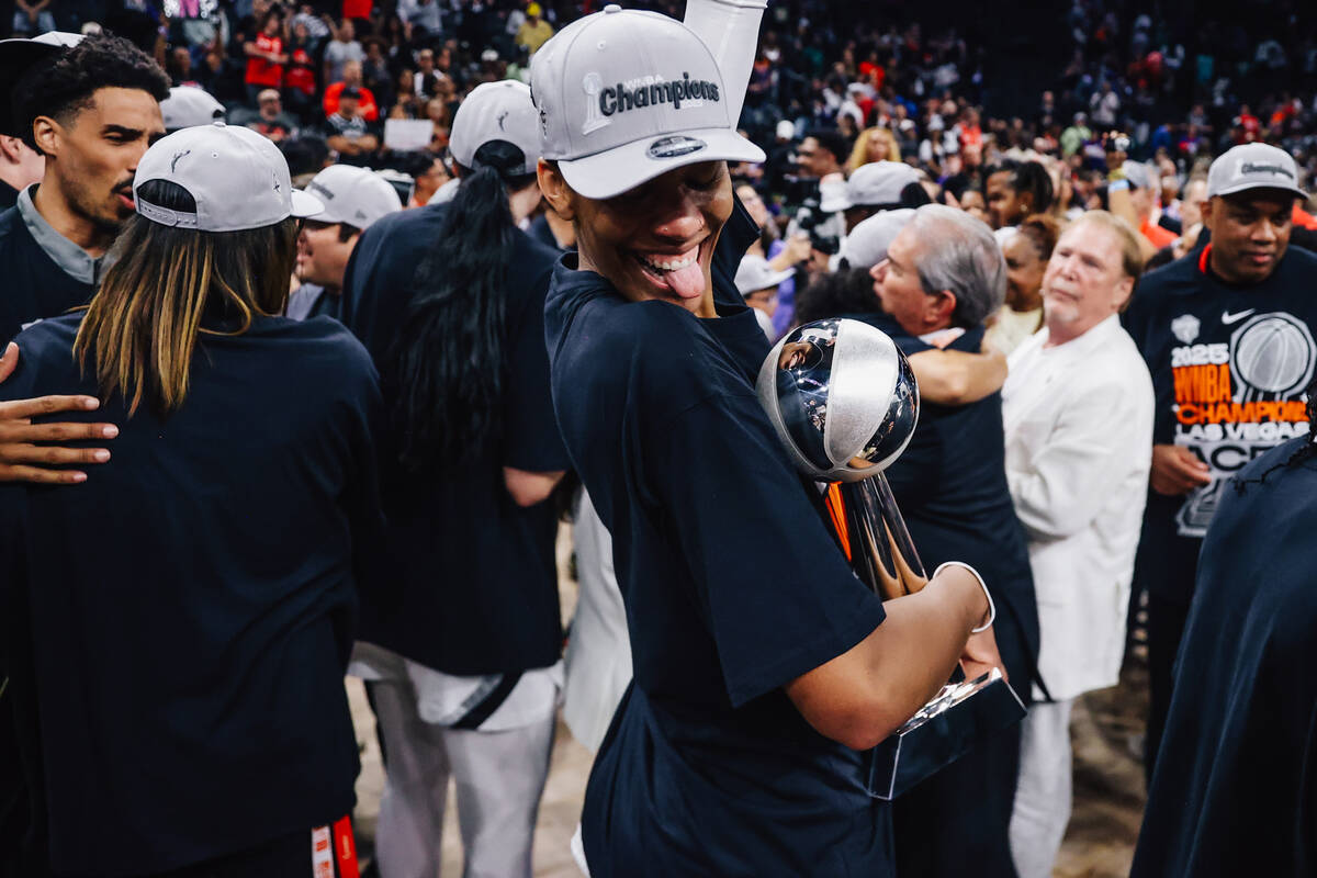 Aces center A'ja Wilson celebrates winning the WNBA championship following game four of a ...