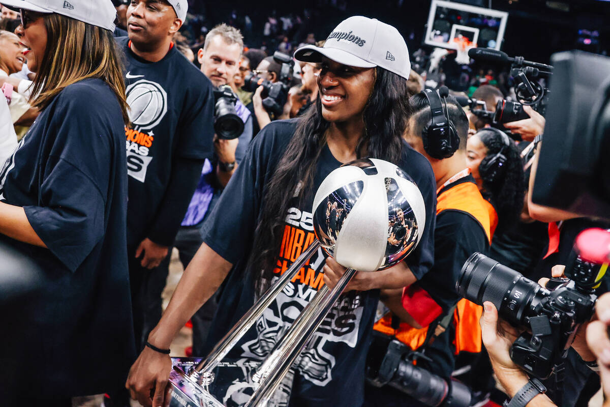 Aces guard Jackie Young celebrates winning the WNBA championship following game four of a WNBA ...
