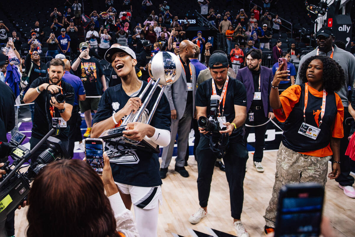 Aces center A'ja Wilson celebrates winning the WNBA championship following game four of a ...