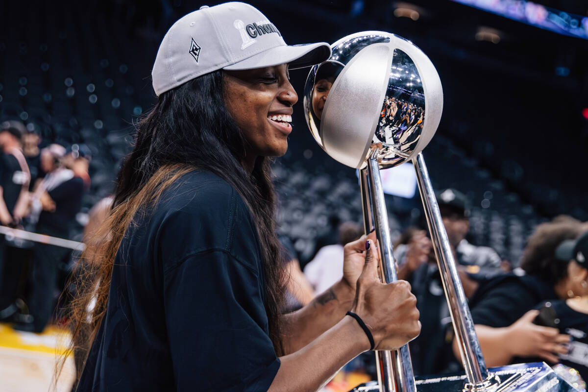 Aces guard Jackie Young celebrates winning the WNBA championship following game four of a WNBA ...