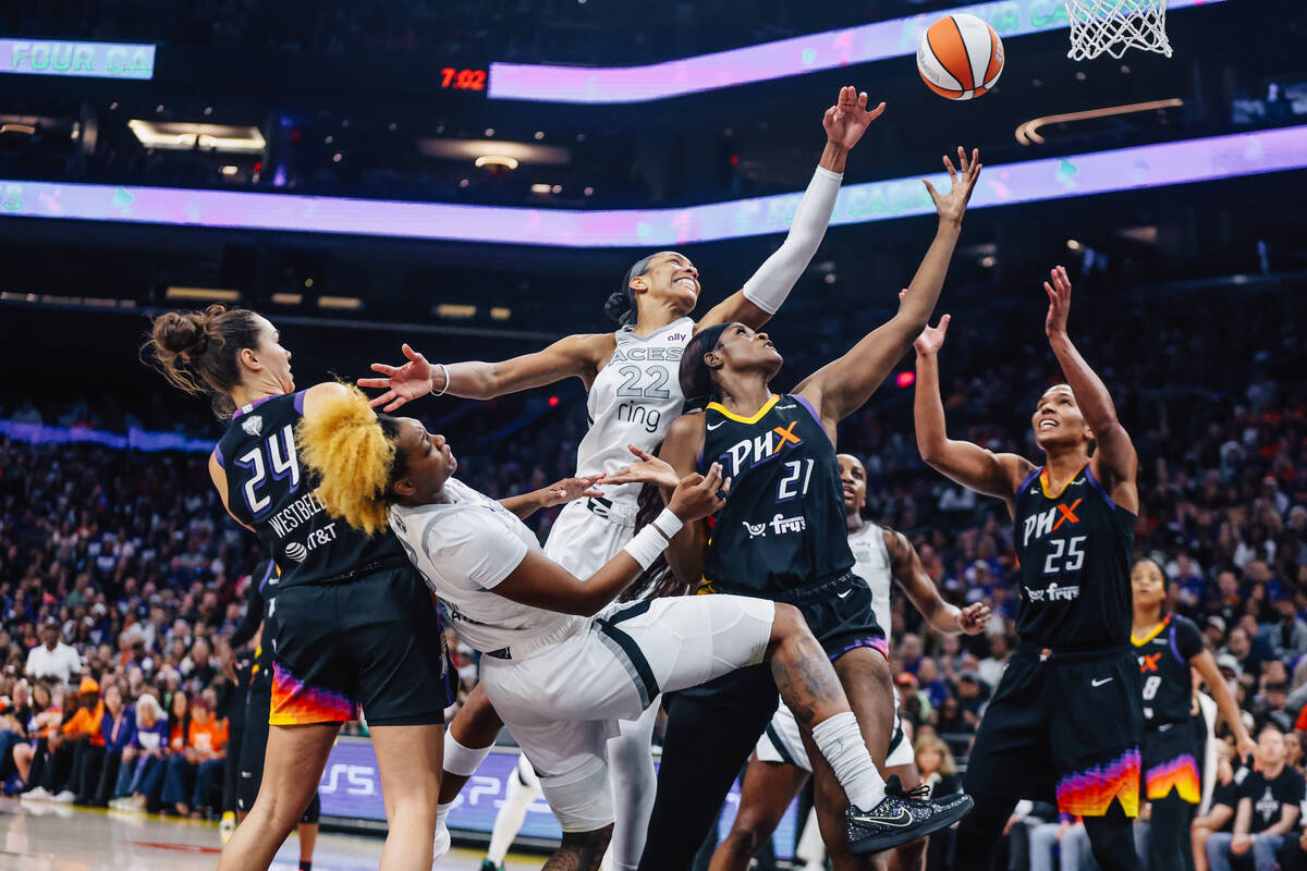 Aces center A'ja Wilson (22) reaches for a loose ball during game four of a WNBA finals ma ...