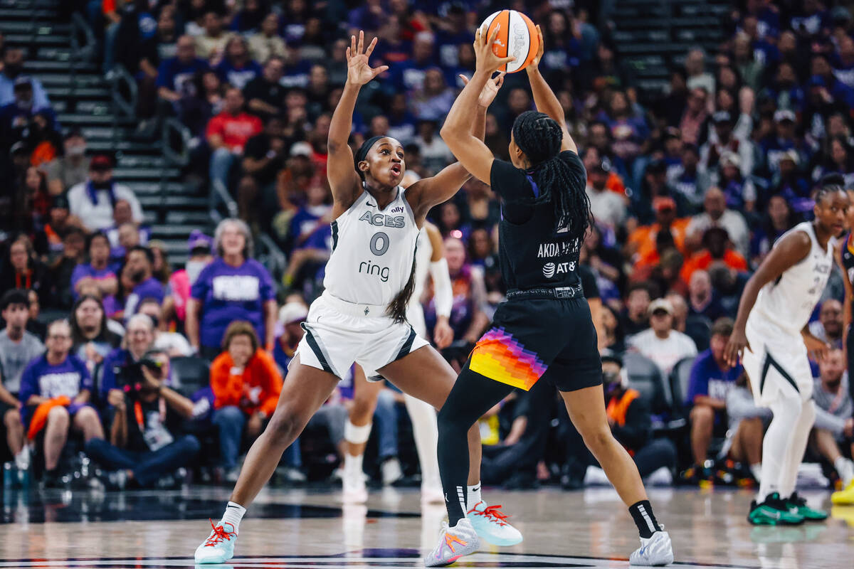 Aces guard Jackie Young (0) guards Phoenix Mercury guard Monique Akoa Makani (8) during game fo ...