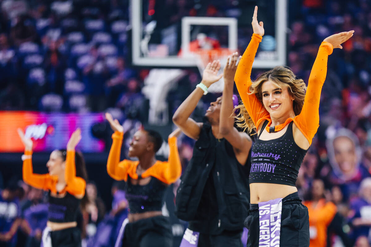 Dancers clap during game four of a WNBA finals match up between the Aces and Phoenix Mercury at ...