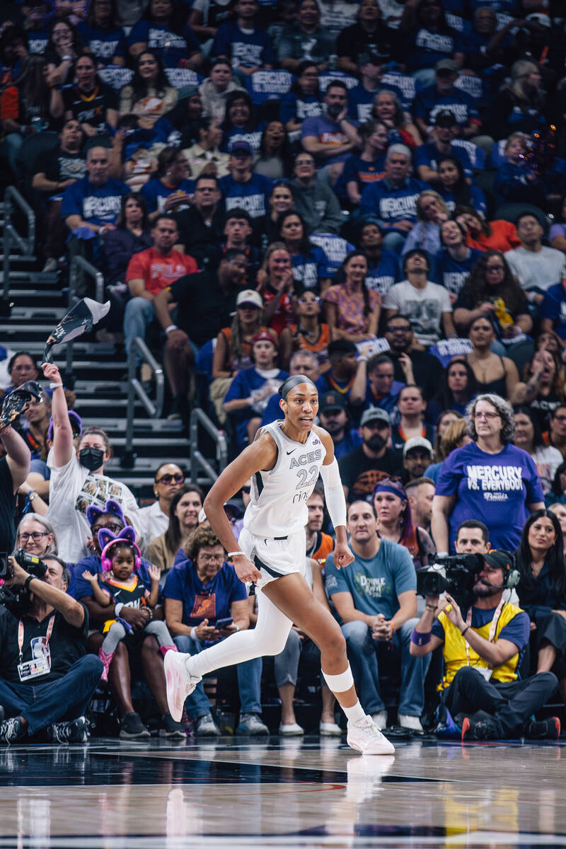 Aces center A'ja Wilson (22) runs down the court during game four of a WNBA finals match u ...