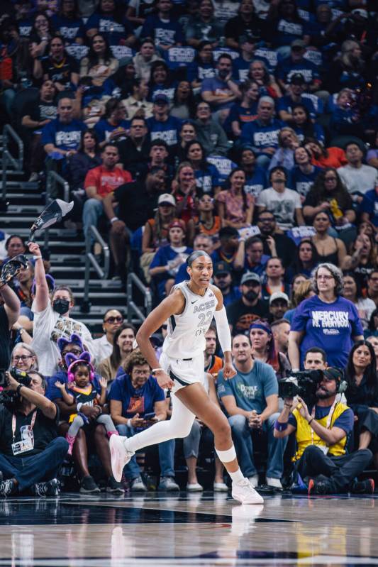 Aces center A'ja Wilson (22) runs down the court during game four of a WNBA finals match u ...