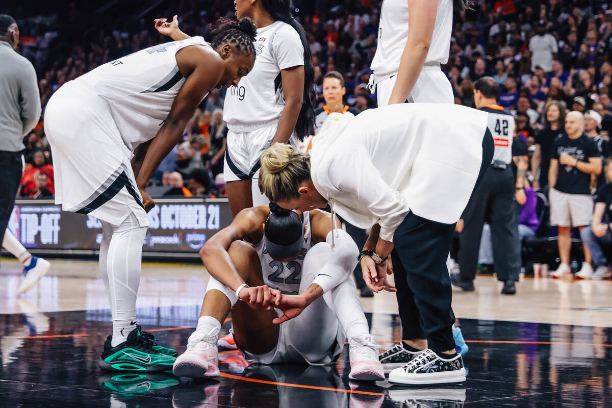 Aces head coach Becky Hammon checks on Aces center A'ja Wilson (22) during game four of a ...