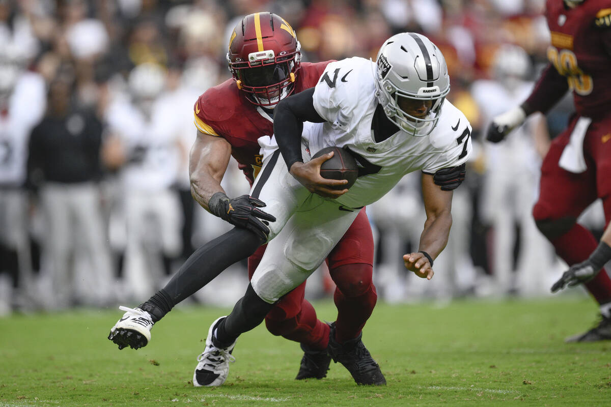 Washington Commanders linebacker Bobby Wagner (54) sacks Las Vegas Raiders quarterback Geno Smi ...