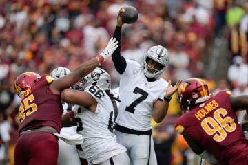 Las Vegas Raiders quarterback Geno Smith (7) throws during the first half of NFL football game ...
