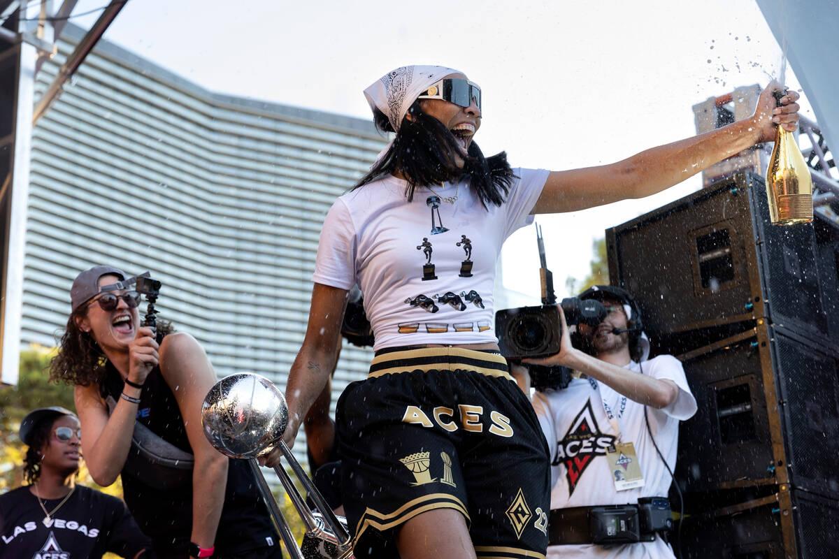 Las Vegas Aces forward and 2022 WNBA MVP A'ja Wilson, holding the 2022 WNBA Championship trophy ...