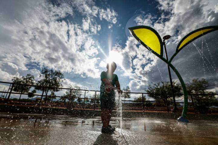 Eric Federizo, 5, plays in the water as a storm front passes over Huckleberry Park Friday, Oct. ...