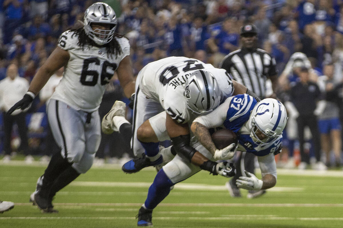 Raiders offensive tackle Stone Forsythe (70) tackles Indianapolis Colts defensive end Laiatu La ...
