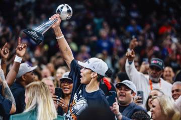 Aces center A'ja Wilson (22) celebrates winning MVP after winning the the WNBA championshi ...