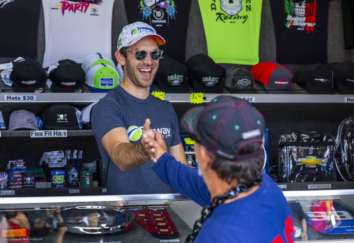 Racer Daniel Suarez has fun with fans while signing autographs in the fan zone during the Focu ...