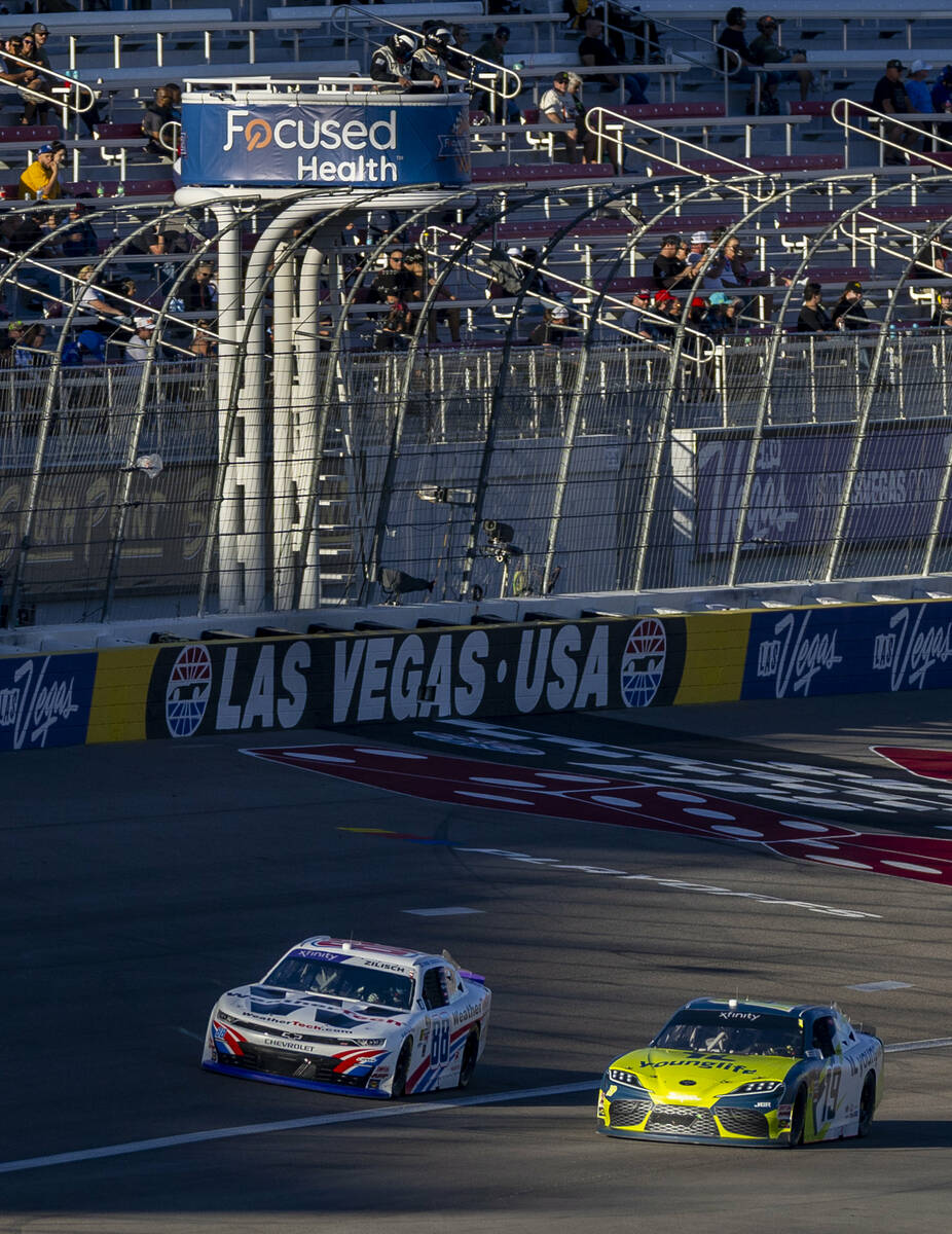 Drivers Aric Almirola (19) and Connor Zilisch (88) battle side by side during the Focused Healt ...