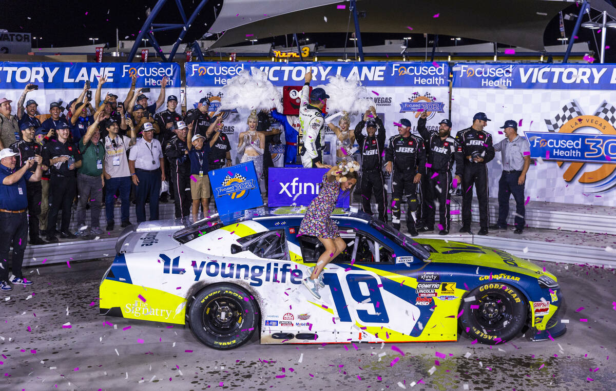 Driver Aric Almirola (19) celebrates his win with his daughter Abby and team for the Focused He ...
