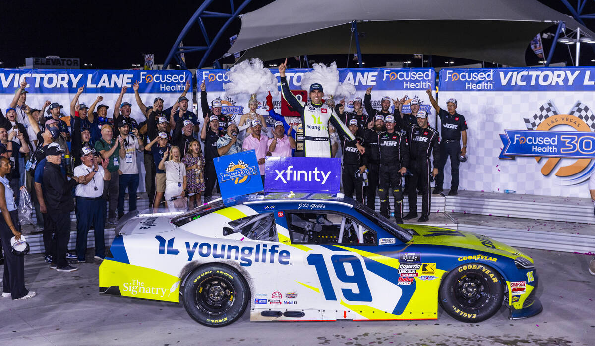Driver Aric Almirola (19) celebrates his win with his team for the Focused Health 302 NXS Playo ...