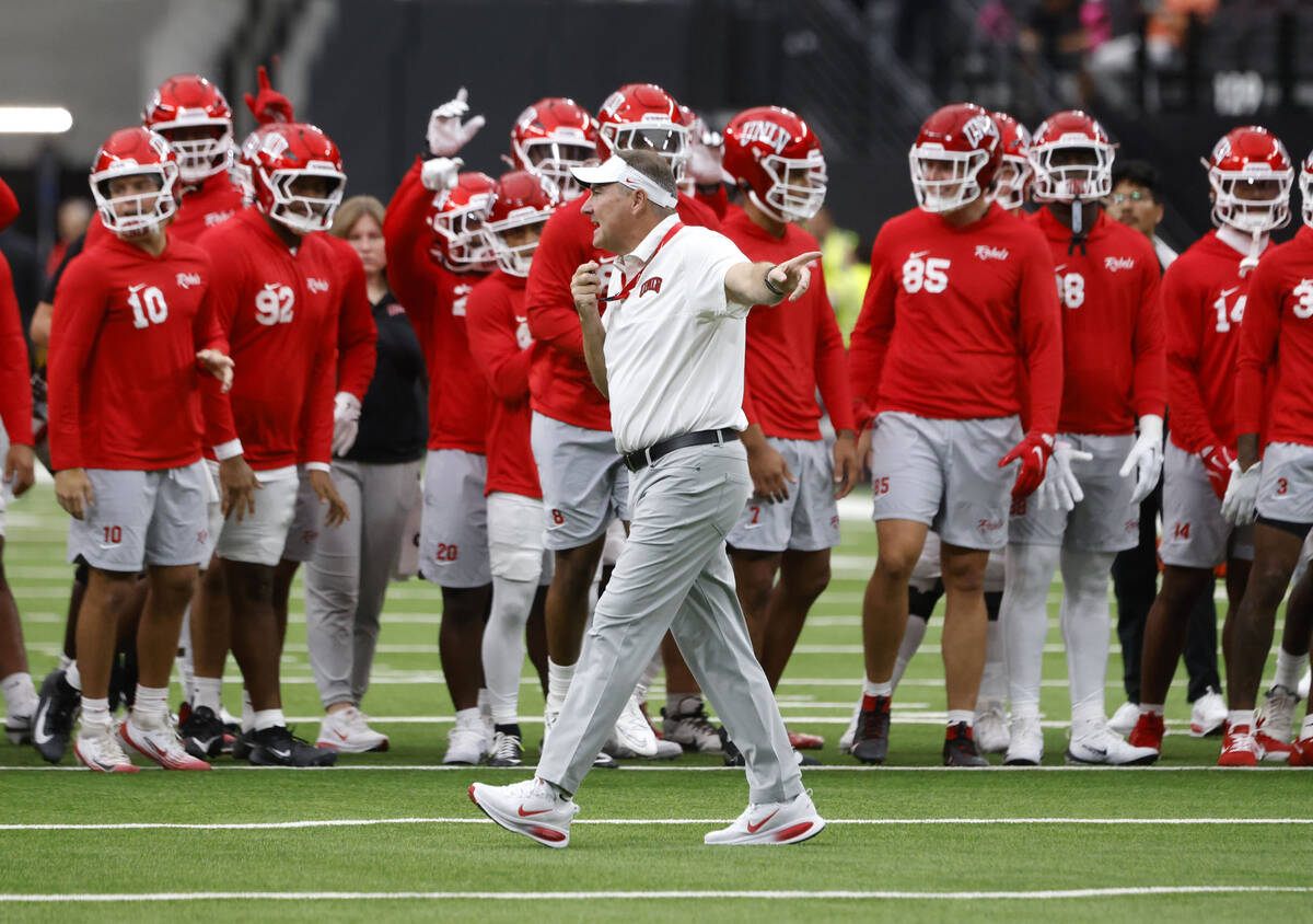 UNLV head coach Daniel Mullen signals as his players prepare to warm up to face Air Force Falco ...