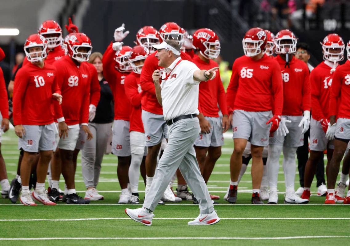 UNLV head coach Daniel Mullen signals as his players prepare to warm up to face Air Force Falco ...