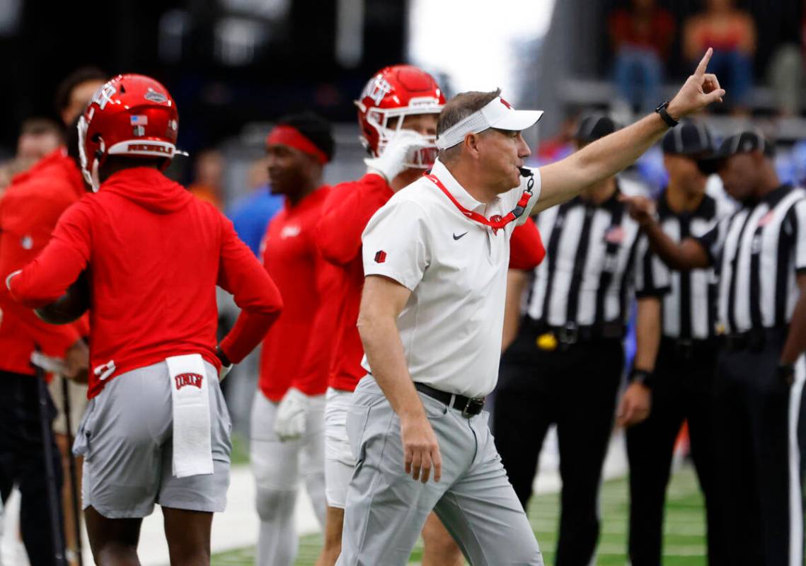 UNLV head coach Daniel Mullen signals as his players prepare to warm up to face Air Force Falco ...