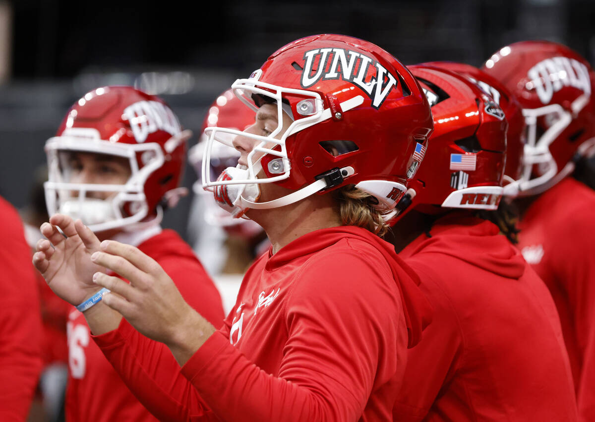 UNLV quarterback Anthony Colandrea (10) and his teammates take the field as they prepare to fac ...