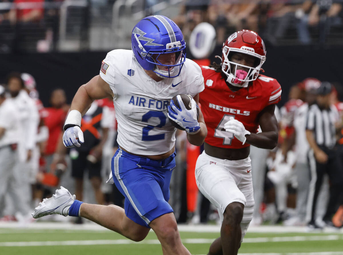 Air Force Falcons running back Owen Allen (2) runs for a touchdown as UNLV defensive back Andre ...