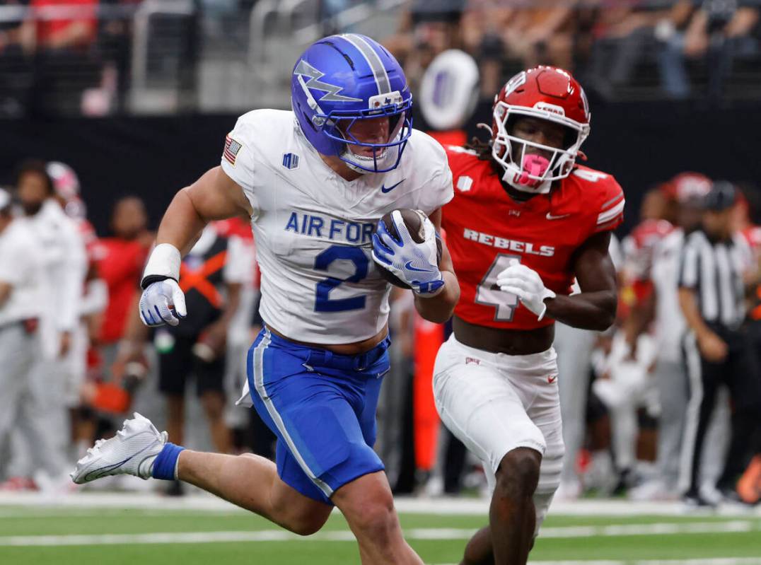 Air Force Falcons running back Owen Allen (2) runs for a touchdown as UNLV defensive back Andre ...