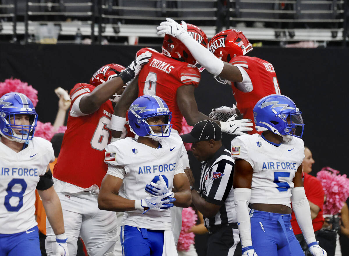 UNLV running back Jai'Den Thomas (9) celebrates his touchdown with his teammates as Air Fo ...
